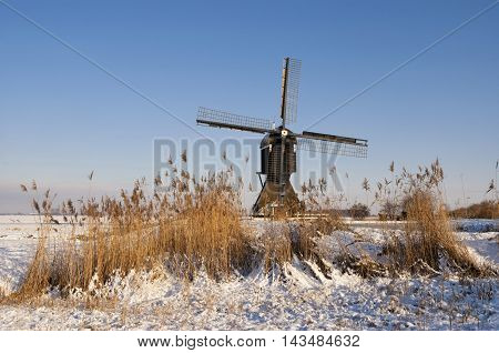 The Broekmolen windmill near Streefkerk in a snow covered landscape