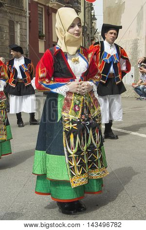 CAGLIARI, ITALY - May 1, 2013: 357 ^ Religious Procession of Sant'Efisio - Sardinia - portrait of a beautiful girl in traditional Sardinian costume
