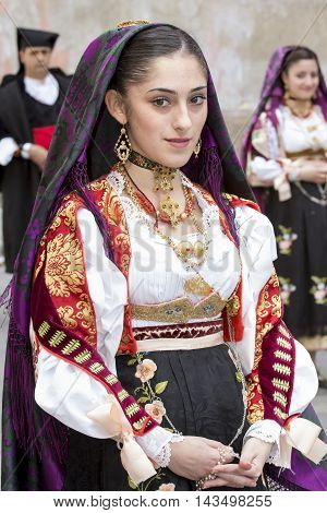 CAGLIARI, ITALY - May 1, 2014: 358 ^ Religious Procession of Sant'Efisio - Sardinia - portrait of a beautiful girl in traditional Sardinian costume