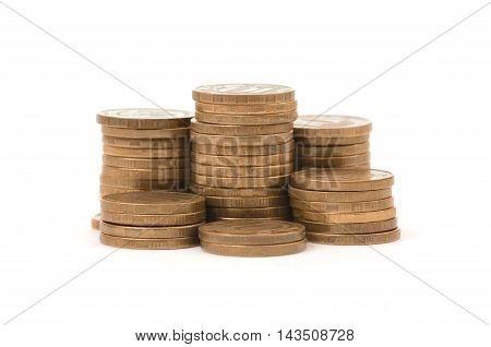 Stacks of golden coins isolated on a white background. Money and wealth. Prosperity and success. Economy and finance.