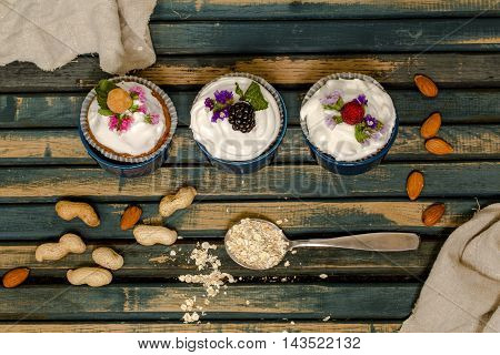 Beautiful Muffins With Berries On Wooden Background Nuts Honey