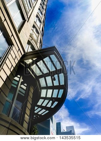 Glass awning on the side of a building exterior