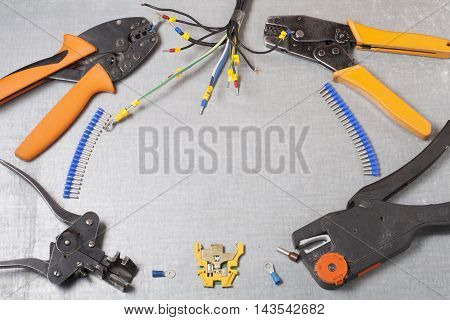 Set of electrical tool on wooden background. Accessories for engineering work, energy concept