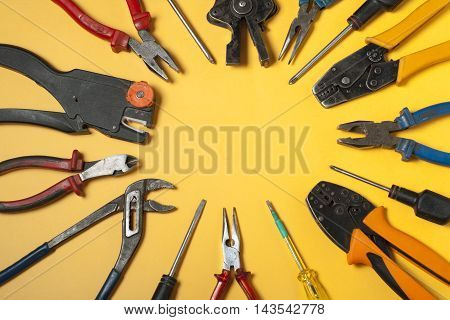 Set of electrical tool on wooden background. Accessories for engineering work, energy concept
