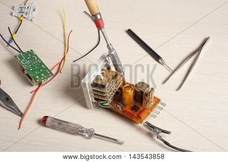 Set of electrical tool on wooden background. Accessories for engineering work, energy concept