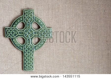 christian green cross on burlap for st patricks day and easter