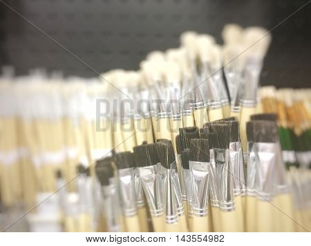 Blurred paint brushes in a stationery store.