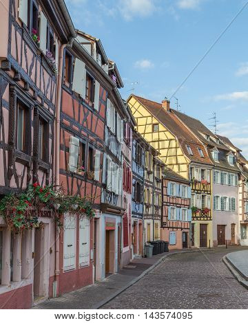 COLMAR FRANCE - 30TH JULY 2016: A view of colourful timber framed buildings along Little Venice in Colmar during the morning