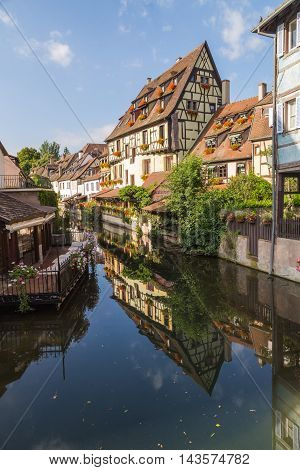 COLMAR FRANCE - 30TH JULY 2016: A view of colourful timber framed buildings near Rue Turenne at La Petite Venise in Colmar during the morning