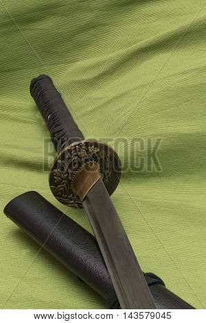 Japanese traditional samurai damask sword on the background