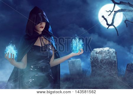 Asian Beauty Witch Woman With Blue Fire On Her Hand