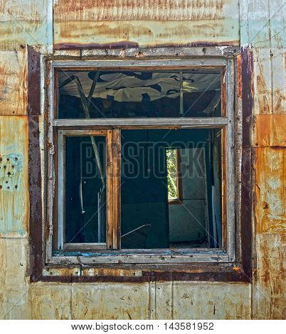 An old window in an old abandoned house. An old window. Windows.