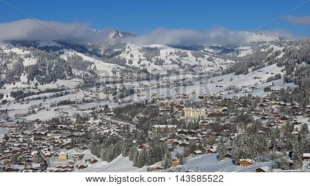Gstaad in winter. Village and holiday resort in the Swiss Alps.