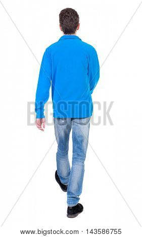 Back view of going  handsome man. walking young guy . Rear view people collection.  backside view of person.  Isolated over white background. Curly boy in a warm blue sweater goes away.