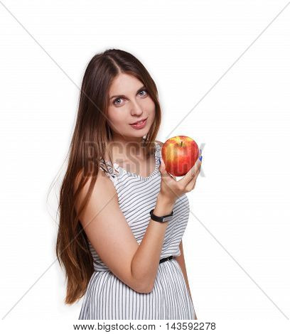 Beautiful long-haired young woman with big ripe red apple in hand. Female portrait isolated on white background. Girl with fitness tracker bracelet on hand, healthy food and diet concept.
