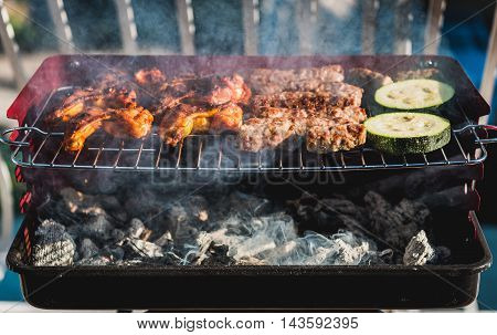 Delicious Meat On Barbecue Grill With Coal On Balcony.