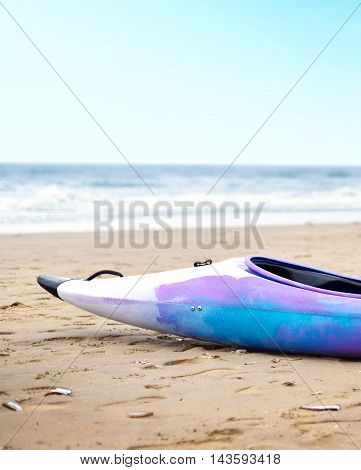 Canoe on a beach with selective focus and copy space.