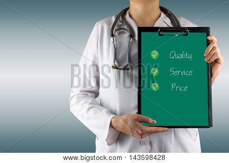 Quality - Service - Price - Female doctor's hand holding medical clipboard, stethoscope. Concept of Healthcare And Medicine. Copy space.