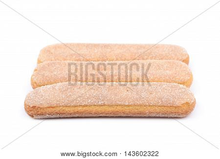 Ladyfinger savoiardi biscuit cookies lined up, composition isolated over the white background