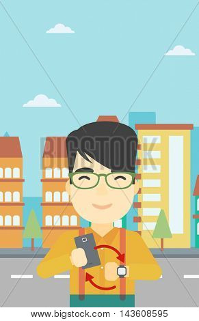 An asian young man holding smartphone and looking at his smart watch. Concept of synchronization between smartwatch and smartphone. Vector flat design illustration. Vertical layout.
