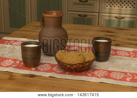 Still life with pottery milk and cookies in the kitchen in the countryside