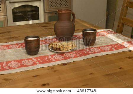 Still life with pottery milk and pipe in the kitchen in the countryside