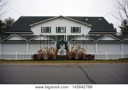 WEQUETONSING, MICHIGAN / UNITED STATES - DECEMBER 22, 2015: The Pennsylvania House is a condominium on Pennsylvania Avenue in Wequetonsing.