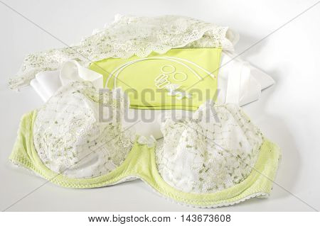 Bra in green and White with sewing accessories