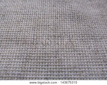 Close-up of natural woven linen textile texture background