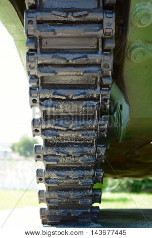 Caterpillar track of russian tank. Detail of an armored military vehicles. Tank trak.