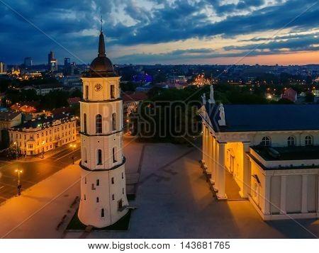 Aerial top night view of Old Town in Vilnius, Lithuania: the cathedral in sunrise
