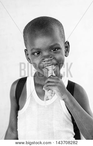 KARA, TOGO - MAR 9, 2013: Unidentified Togolese boy portrait. Children in Togo suffer of poverty due to the unstable econimic situation
