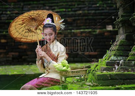 The little girl with the old temples in Laos.