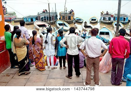 Varanasi Uttar Pradesh India - July 30, 2011: Unidentified Hindu pilgrims expecting for the Ganga Aarti ritual on 30 July 2011 in Varanasi. Puja is a Hindu ritual that takes place at Triveni Ghat on the banks of the river Ganges