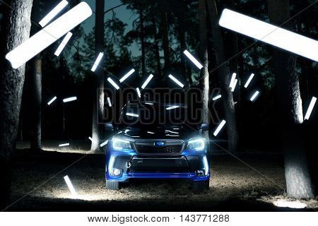 Saratov, Russia - September 28, 2015: Car Subaru Forester Stand In Forest, Concept Lights At Night