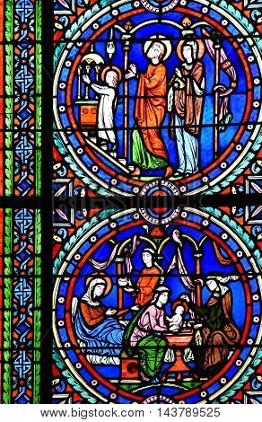 Poissy France - august 6 2016 : stained glass window of the historical collegiate church where the king Saint Louis was baptised