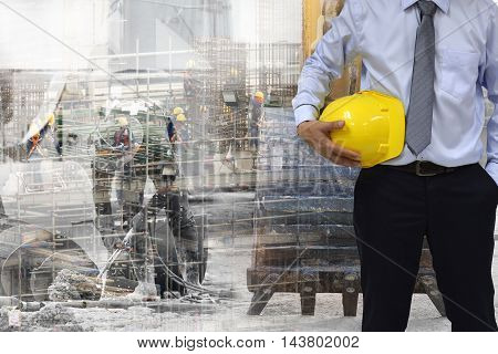 Work safety concept : work out door at construction site during used personal protective equipment   by hard hat .
