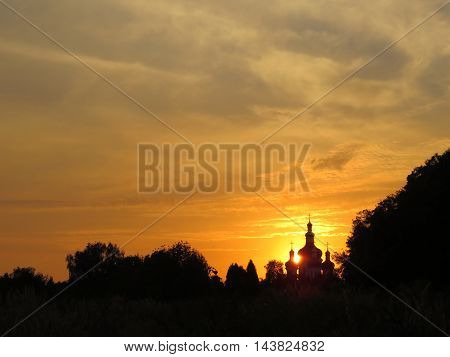 The building of the Orthodox Church against the setting sun