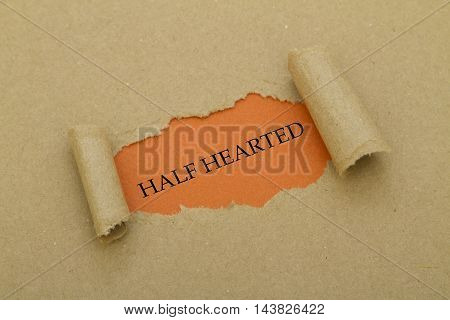HALF HEARTED word written under torn paper.