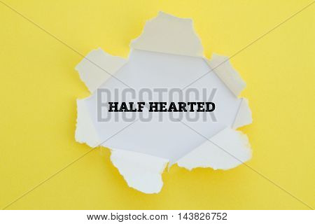 HALF HEARTED word written under torn paper.