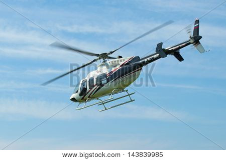 ST. PETERSBURG, RUSSIA - MAY 22, 2016: Flying a helicopter Bell 407GX (RA-01605) close-up