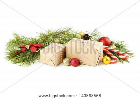Christmax Tree Branch With Baubles, Gift Boxes And Candies On White Background