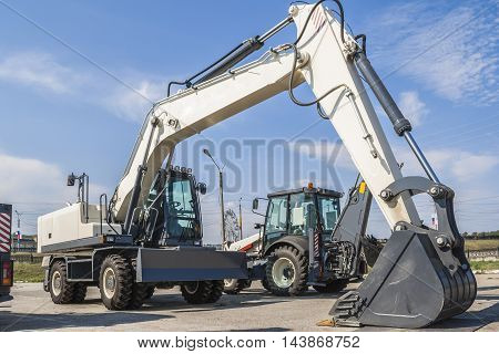The New Excavator Is On The Road In The City