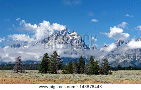 The Grand Teton Mountains with the clouds