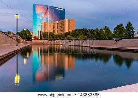 Indiananpolis Indiana USA- Auugust 17 2016. Reflection of moden hotel buildings in the Reflection pool in White River State Park Indianapolis Indiana.