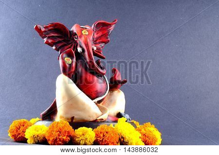 Hindu God Ganesha. Ganesha Idol on grey Background.