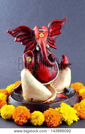 Hindu God Ganesha. Ganesha Idol on grey Background.