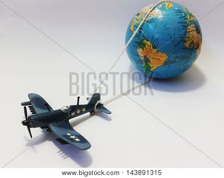 Nueva Esparta, Venezuela 21 august 2016. A litle model airplane tied and carryin a litle world globe