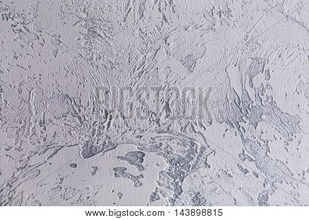 Gray plaster abstract textured uneven wall background