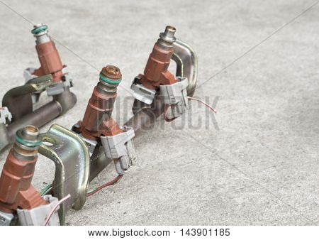 Old and used fuel injectors and fuel injector rail for gasoline engine selective focus